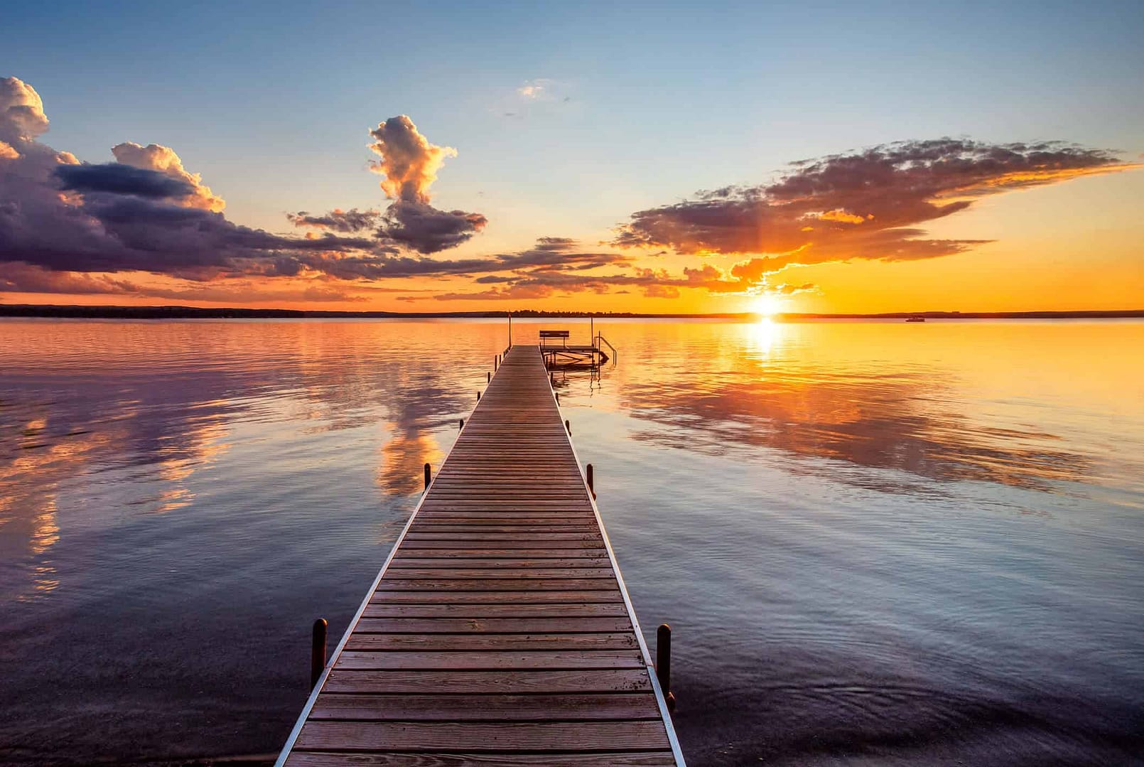 A serene view of a river landing at sunset, symbolizing a comfortable and well-planned retirement with Capitol Landing Wealth.