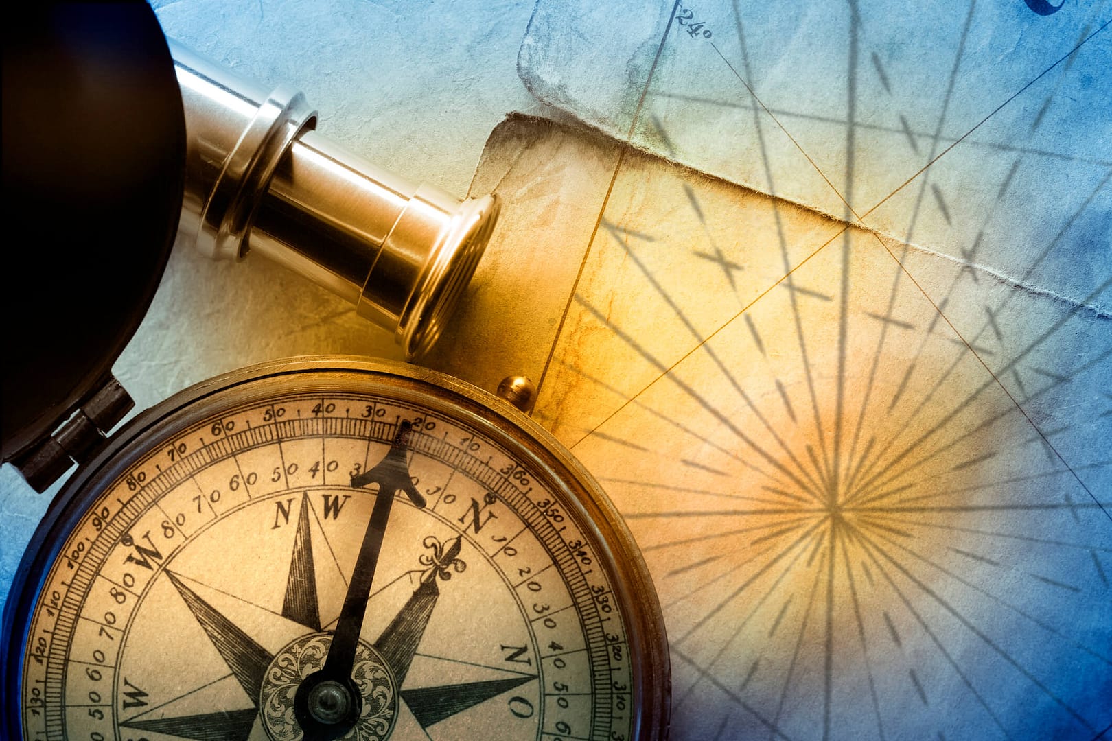 An antique brass compass resting on a nautical chart in warm light, symbolizing the strategic navigation of retirement planning.